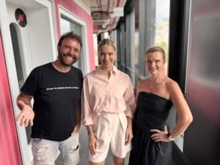 Three people posing together