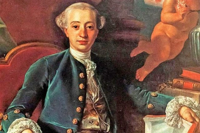 Portrét Giacoma Casanovy v historickém oblečení sedícího na židli.