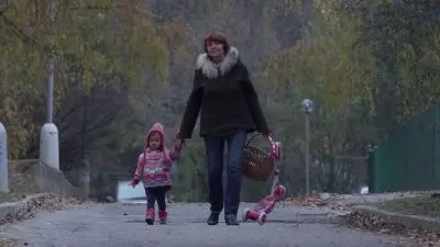 Woman walking with child
