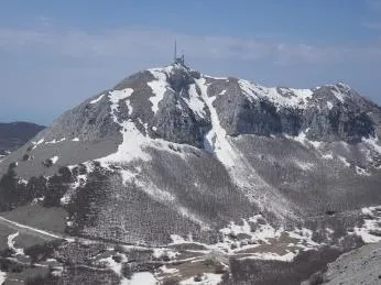 Snowy mountain peak with tower